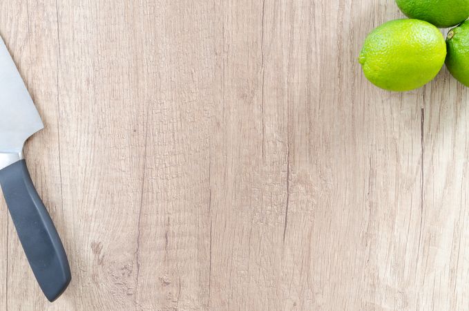 Limes And Knife In Corners Photo
