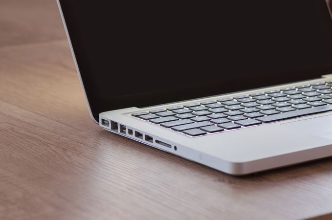 Mac-book On Wooden Table Photo