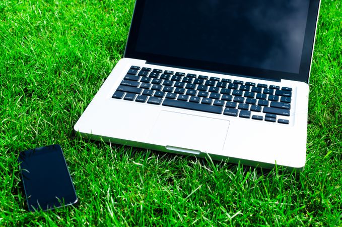 Macbook With Iphone In Lawn Photo