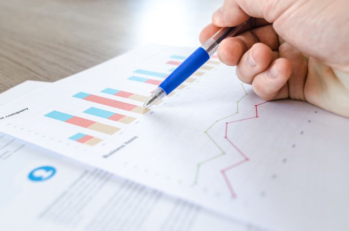 Man Analysed Graph With Help Of Blue Pen Photo