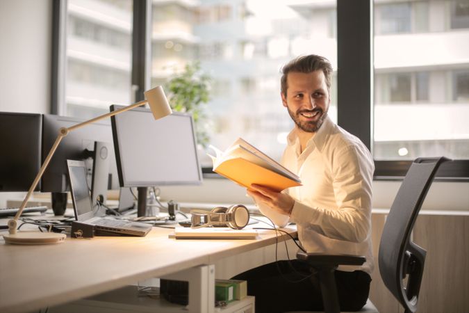 Man Holding A Book Photo