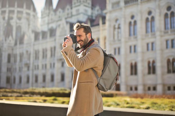 Man Holding And Capturing Images Around Him Photo