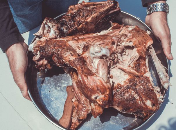 Man Holding Meat Plate Photo