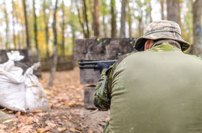 Man Holding Rifle Photo
