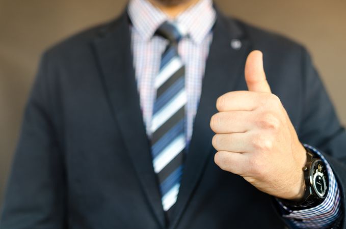 Man In Black Formal Suit Jacket And Thumbs Up Gesture Photo