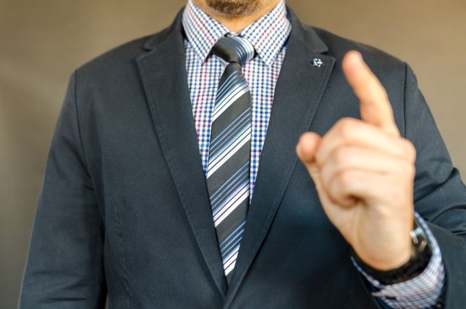 Man In Suit And Explain Something Gesture Photo