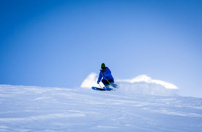 Man Performing Stunt During Snow Surfing Photo