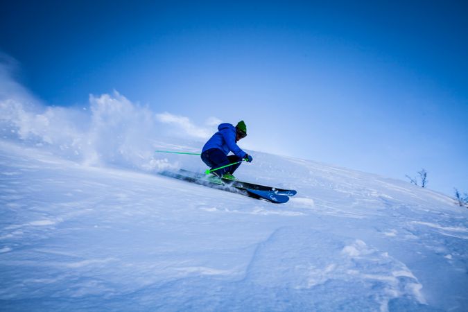 Man Performing Stunt During Snow Surfing Photo