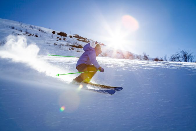 Man Performing Stunt During Snow Surfing While Sunrise Photo