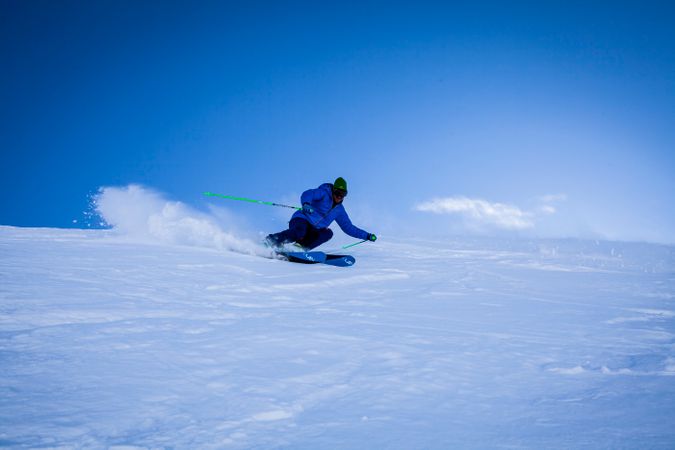 Man Performing Stunt On Snow Covered Mountain Photo
