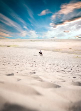 Man Riding Horse In Desert Photo