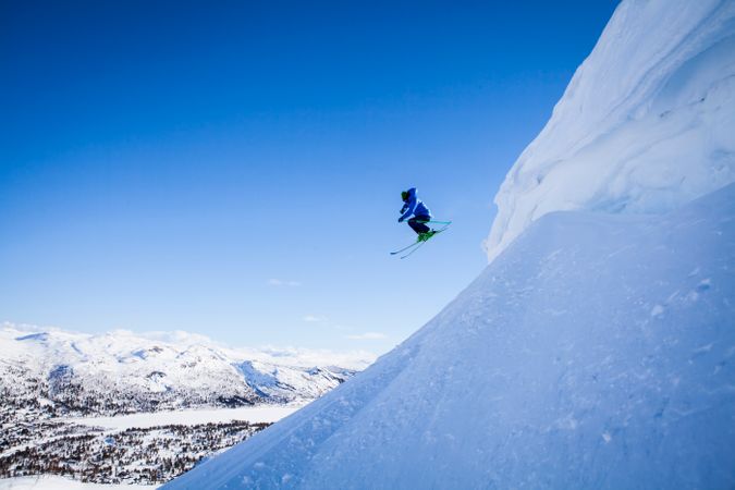 Man Skiing On Snow Covered Mountain Photo