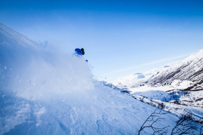 Man Skiing On Snow Covered Mountain Photo