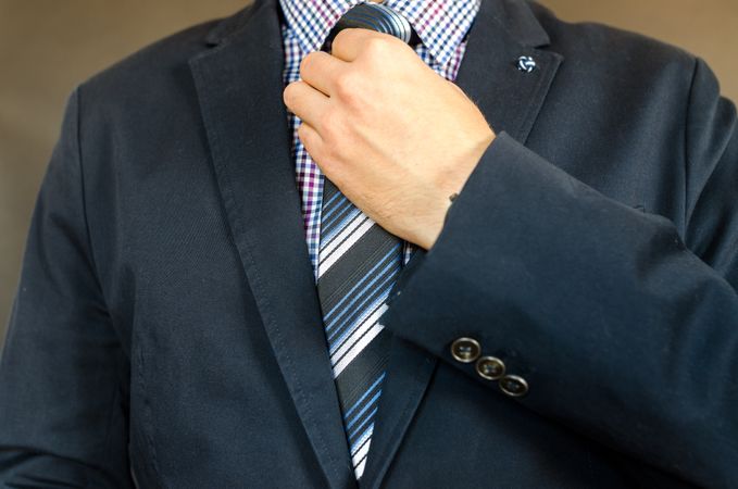 Man Tying His Tie Knot Photo