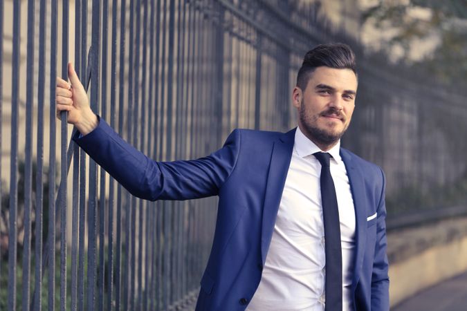 Man Wearing Suit And Posing In Park Photo