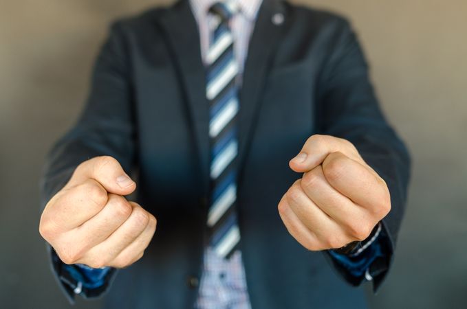 Man Wearing Suit With Angry Gesture Photo