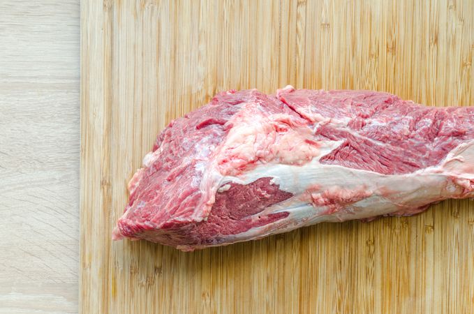 Meat On Wooden Table Photo