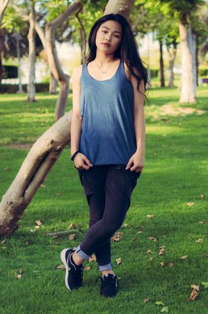 Model Giving Pose With Wearing Racerback Top In Morning In Garden Photo