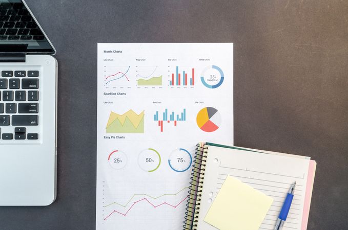 Notebook And Charts With Mac-book Photo
