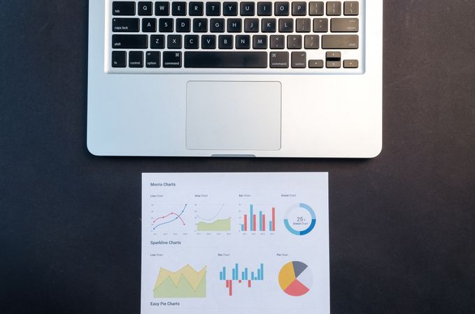 Paper Under Mac-book Photo
