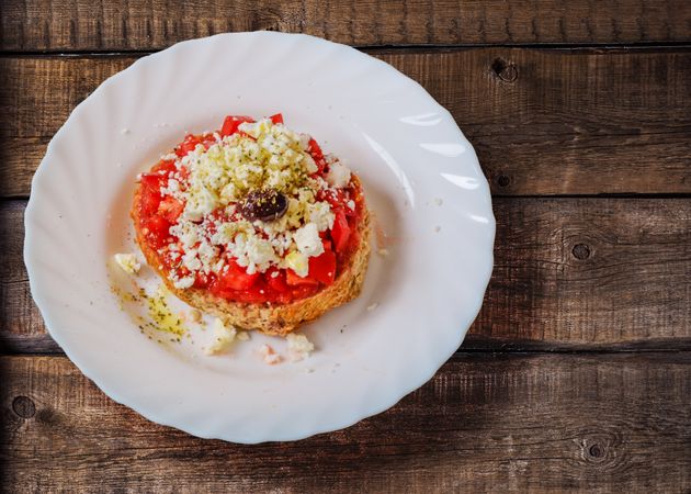 Pastry With Cream In Ceramic Saucer Photo