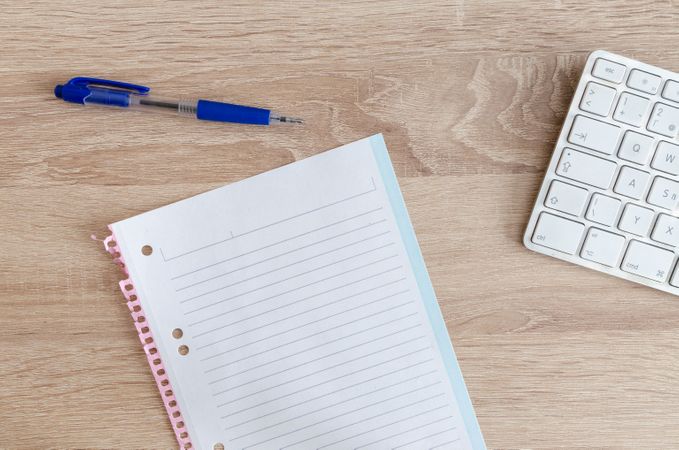Pen,Paper And White Keyboard On Desk Photo