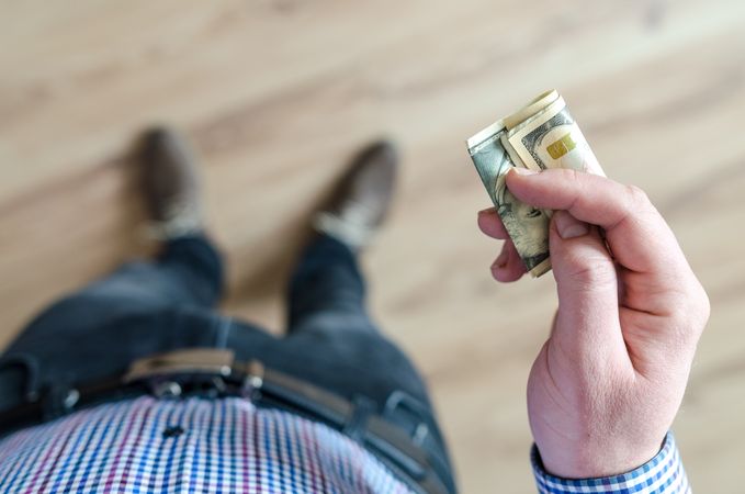 Person Holding Banknote Photo