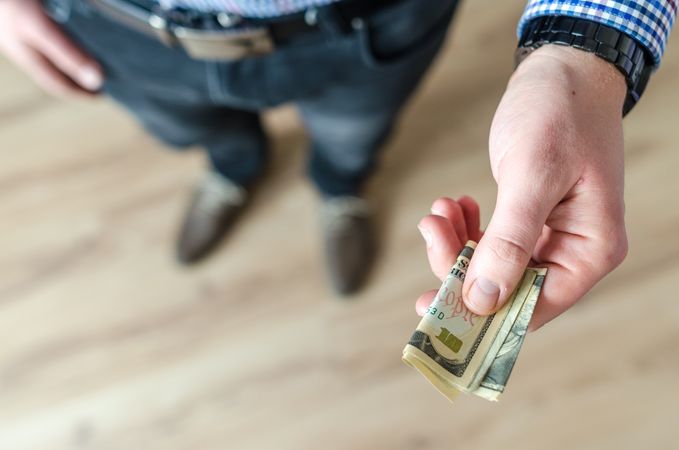 Person Holding Banknote Photo