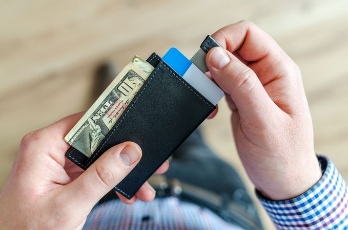 Person Holding Black Card Holder Photo