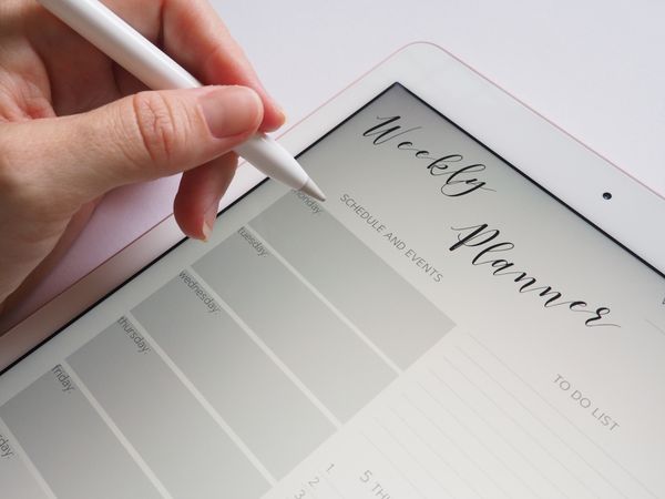 Person Holding White Stylus Photo