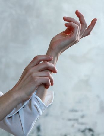 Person In White Long-sleeve Shirt With Both Hands Photo Photo