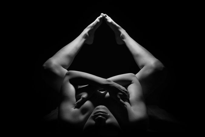 Person Lying Touching Toes Together Photo
