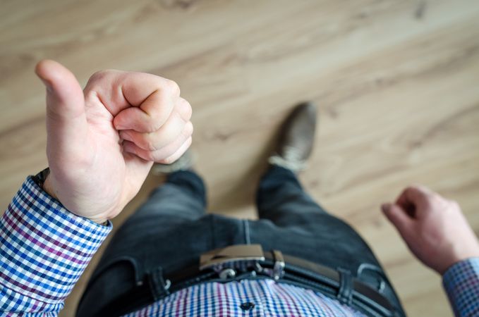 Person Showing His Left Thumb Photo