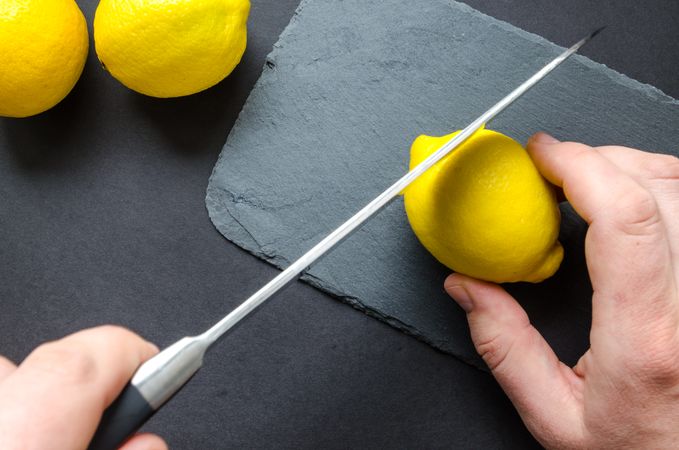 Person Slicing Lemon Photo