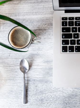 Photo Of Coffee Cup Beside Laptop On Wooden Table Photo