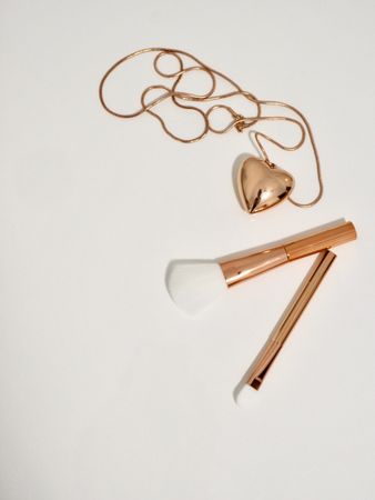 Photo Of Gold Make-up Brushes And Necklace Photo