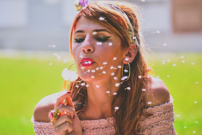 Photo Of Woman Blowing Dandelion Photo