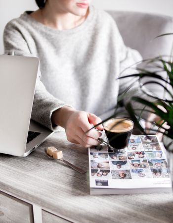 Photo Of Working Woman Holding Clear Glass Mug Photo