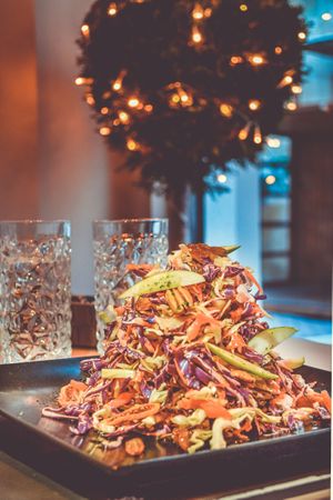 Pile Of Assorted Sliced Vegetables On Square Black Plate Photo