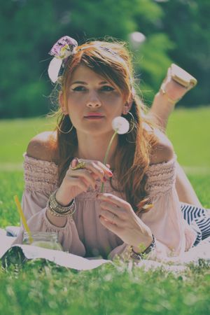 Portrait Of Woman Lying On Grass At Daylight Photography Photo