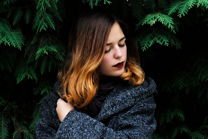 Portrait Of Young Woman In Forest During Winter Photo