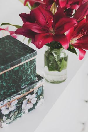 Red Petaled Flower Arrangement On Table Photo