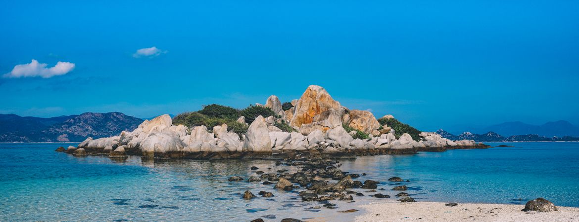 Rocky Island Surrounded By White Water Photo