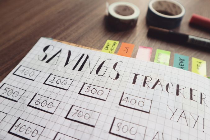 Savings Tracker In Diary Photo