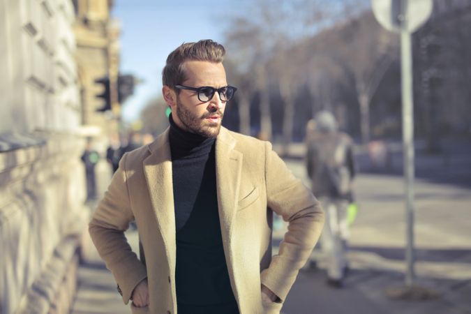 Selective Focus Photo Of Man Wearing Black Turtleneck Top With Jacket On Road Photo