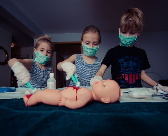 Siblings Cleaning Dolls Blood Photo