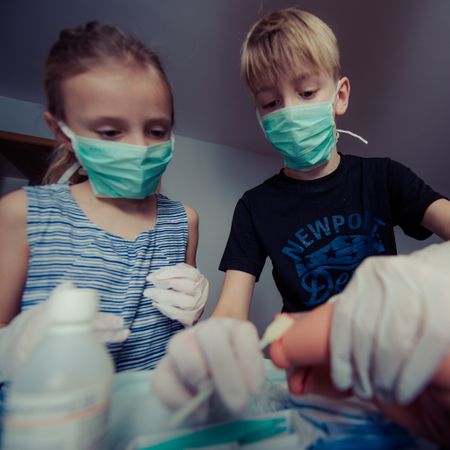 Siblings Playing Surgeon Photo