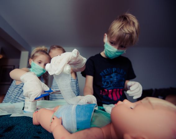 Siblings Surgeons At Operation While Playing Doctor Doctor Photo