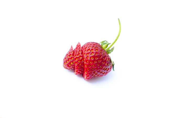 Side View Beautifully Cut In Three Peace Of Strawberry Photo