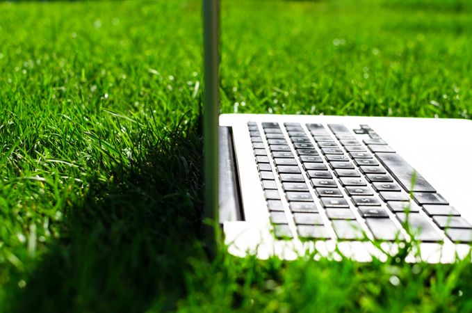 Side View Of Macbook In Lawn Photo